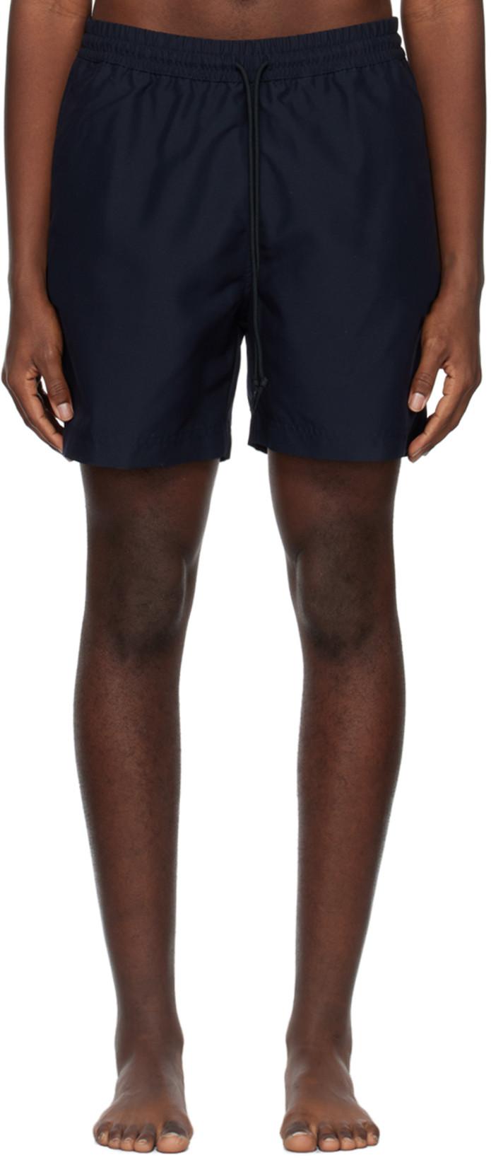 Navy Chase Swim Shorts by CARHARTT WIP