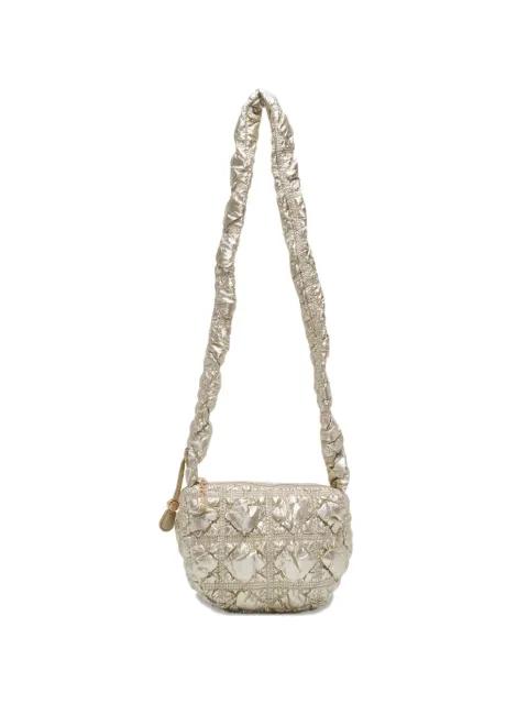 Poing quilted cross body bag by CARLYN