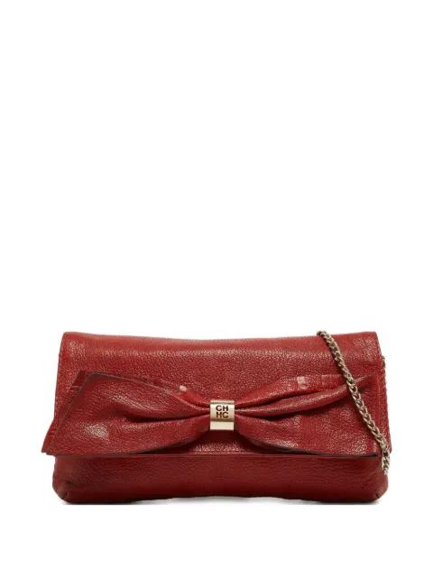 pre-owned CH bow detail leather clutch by CAROLINA HERRERA VINTAGE