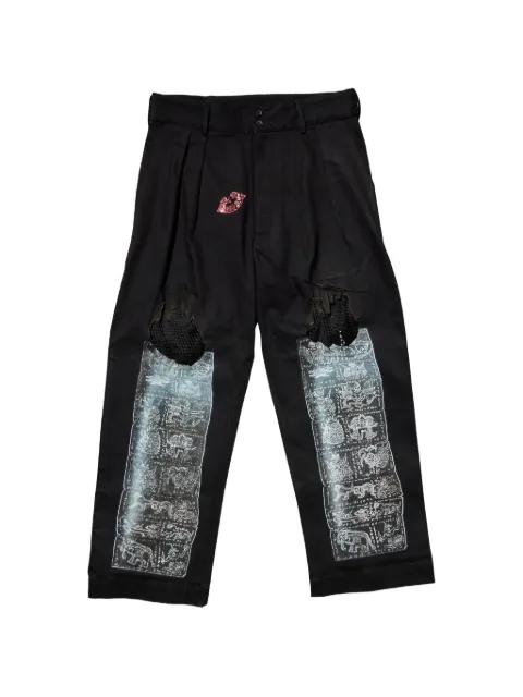 distressed graphic-print trousers by CAROLINA SARRIA