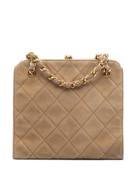 1996-1997 CC Quilted Suede Kiss Lock handbag by CHANEL 