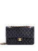 Classic Double Flap Bag Quilted Lambskin Medium shoulder bag by CHANEL 