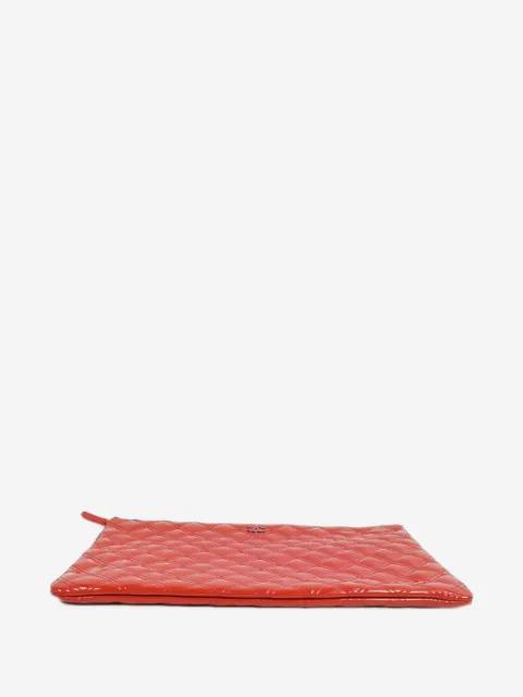 Matelassé O-Case clutch bag by CHANEL 