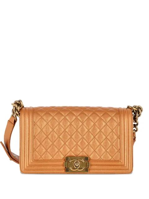 quilted chain medium boy flap bag by CHANEL 