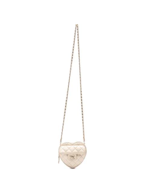 small heart-shape leather cross body bag by CHANEL 