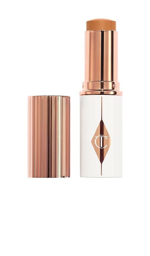 Charlotte Tilbury Unreal Skin Sheer Glow Tint Hydrating Foundation Stick in 12 Tan by CHARLOTTE TILBURY