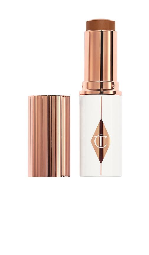 Charlotte Tilbury Unreal Skin Sheer Glow Tint Hydrating Foundation Stick in 14 Deep by CHARLOTTE TILBURY