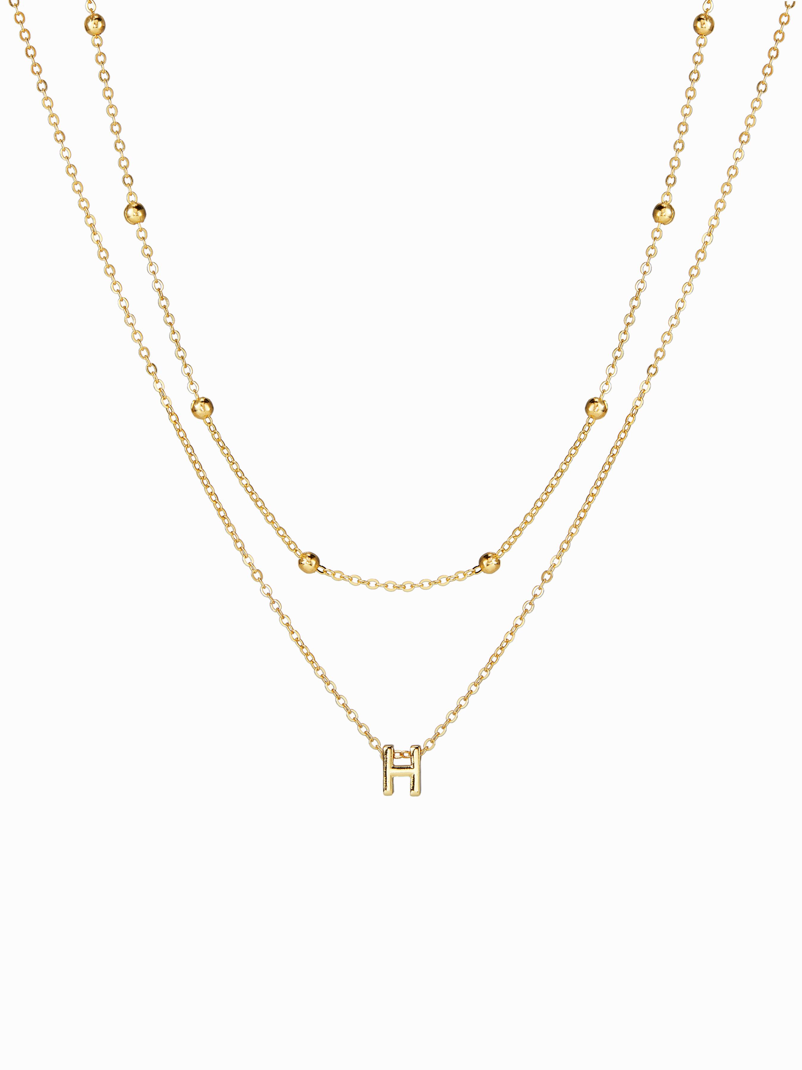 Buchstaben- und perlenbesetzte Layering-Halskette by CIDER