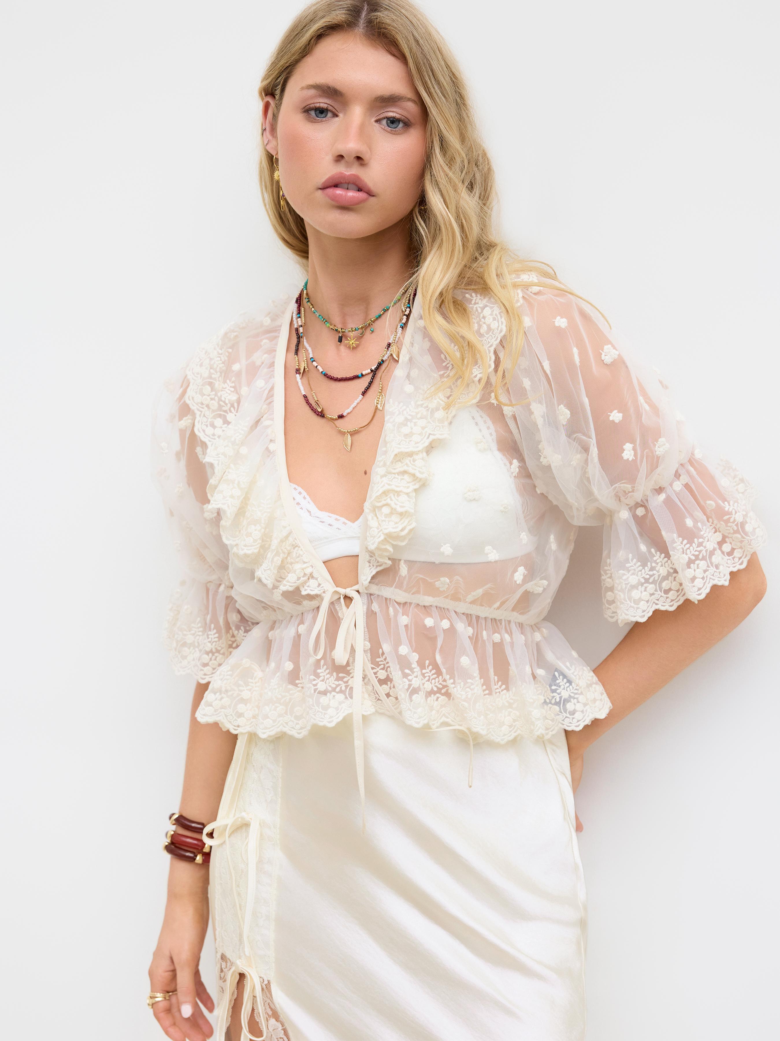 Mesh V-neck Knotted Ruffle Blouse by CIDER