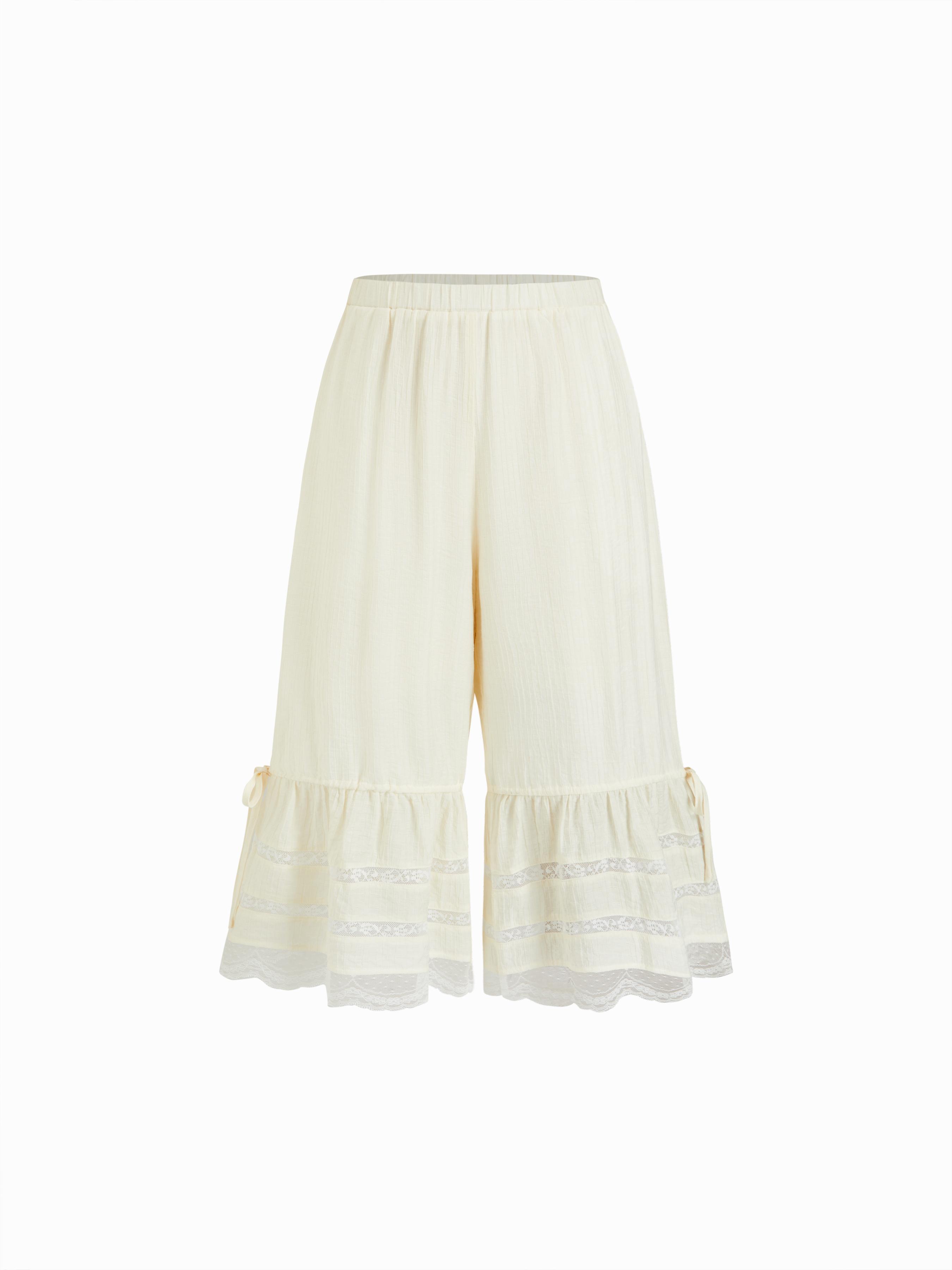 Textured Mid Rise Lace Panel Ruffle Hem Capri Shorts by CIDER