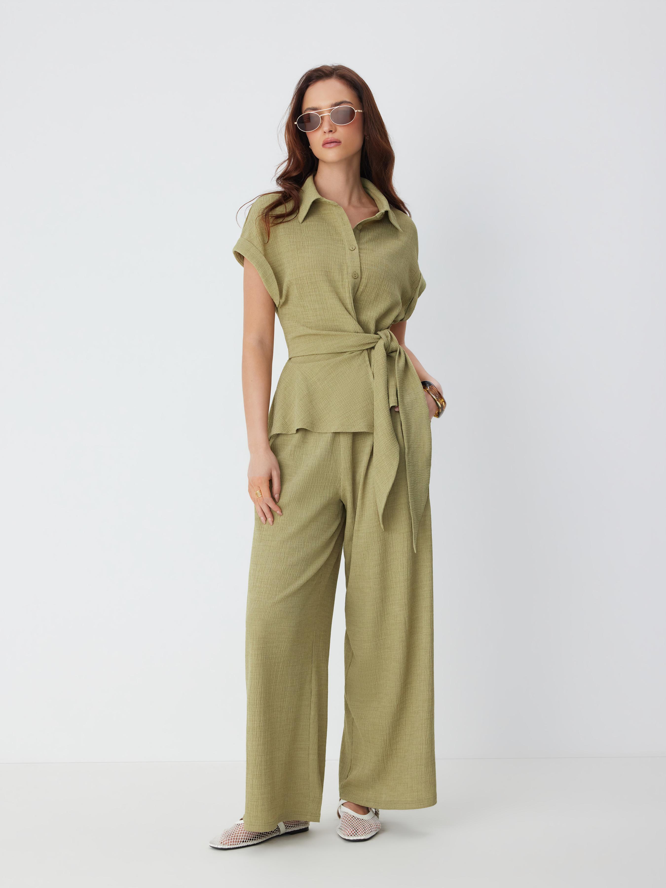 Textured Short Sleeve Draped Wide Leg Jumpsuit by CIDER