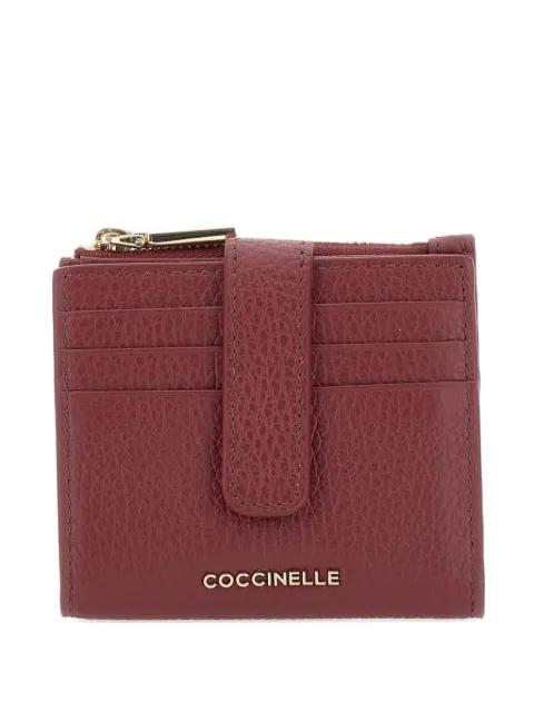 button-fastening leather wallet by COCCINELLE