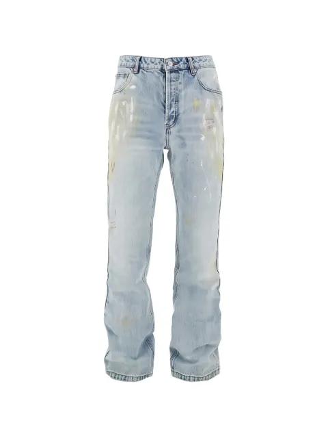 paint-splatter distressed jeans by COLE BUXTON
