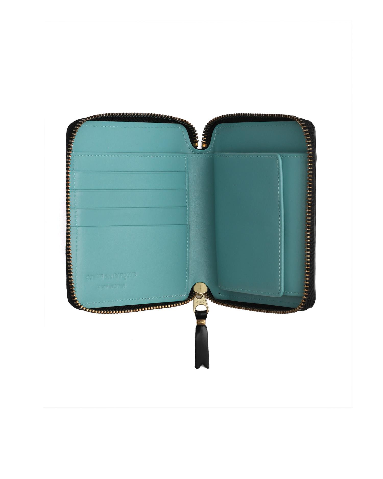 Leather zip wallet with contrast lining by COMME DES GARCONS