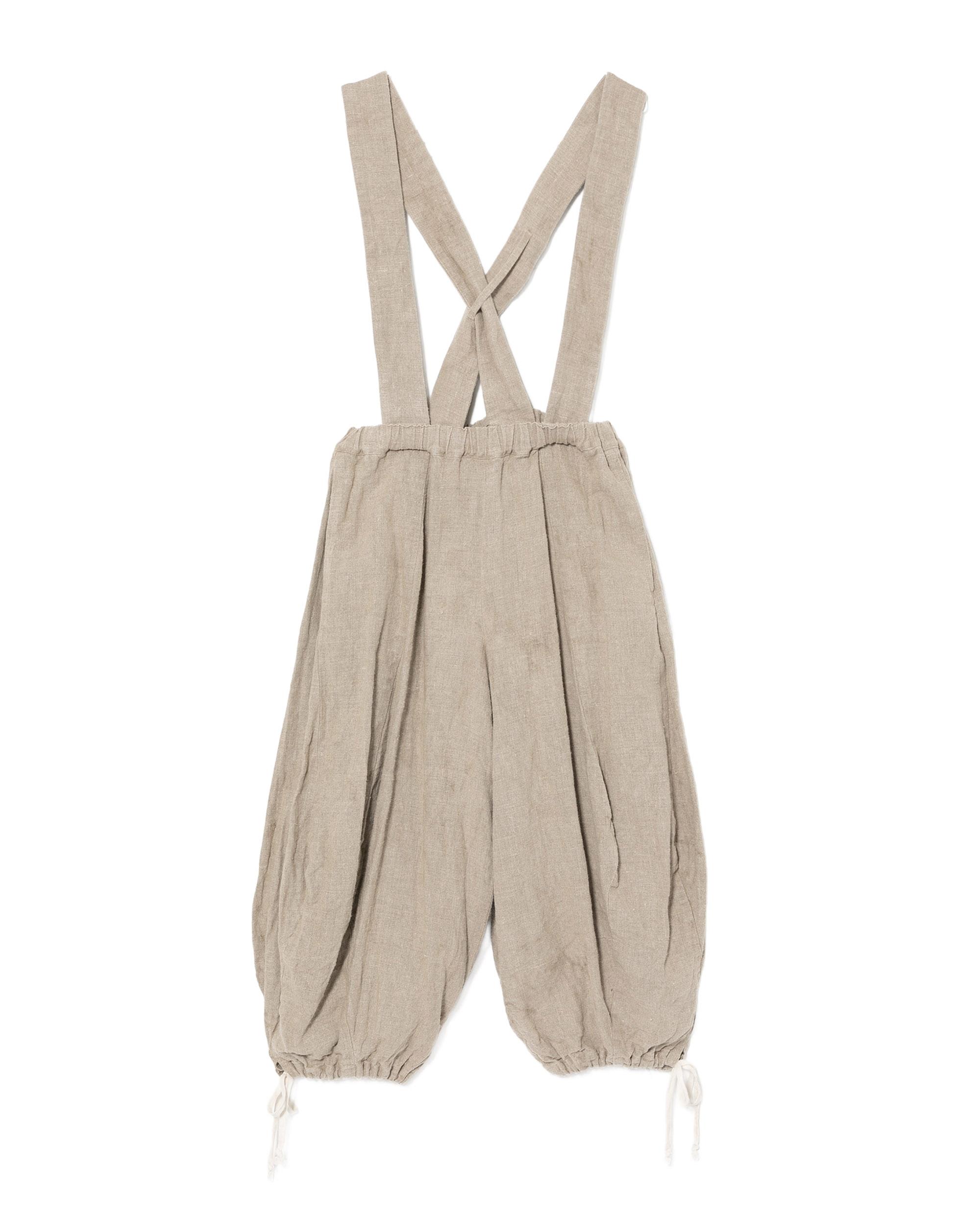 Pants with wide suspender straps by COMME DES GARCONS