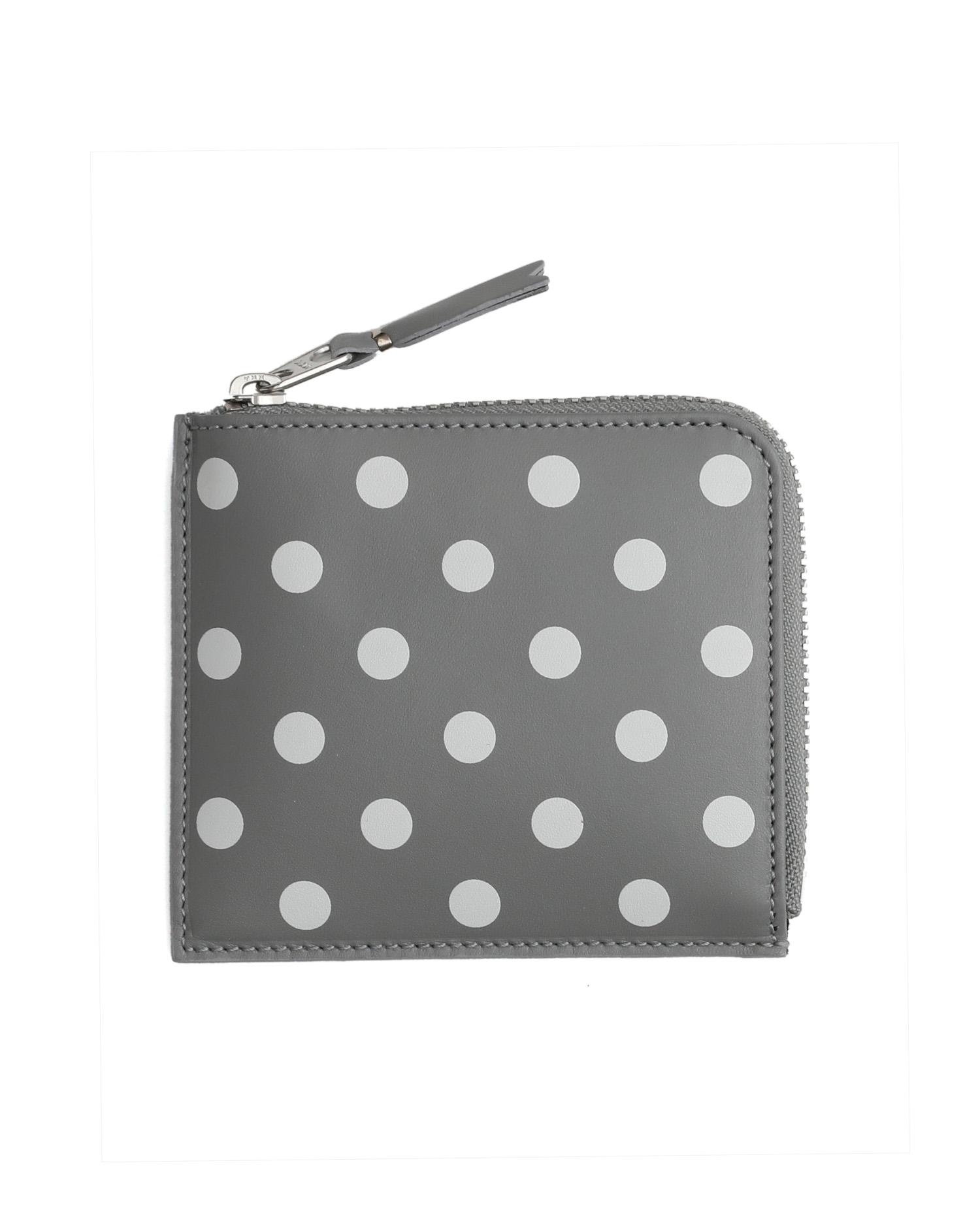 Polka dot zip-around coin pouch by COMME DES GARCONS