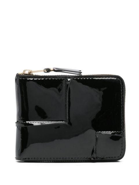 Reversed Hem leather wallet by COMME DES GARCONS