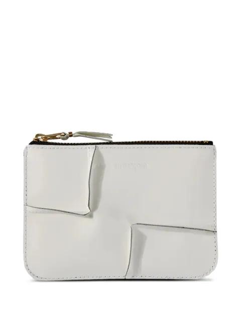 Reversed Hem zipped wallet by COMME DES GARCONS