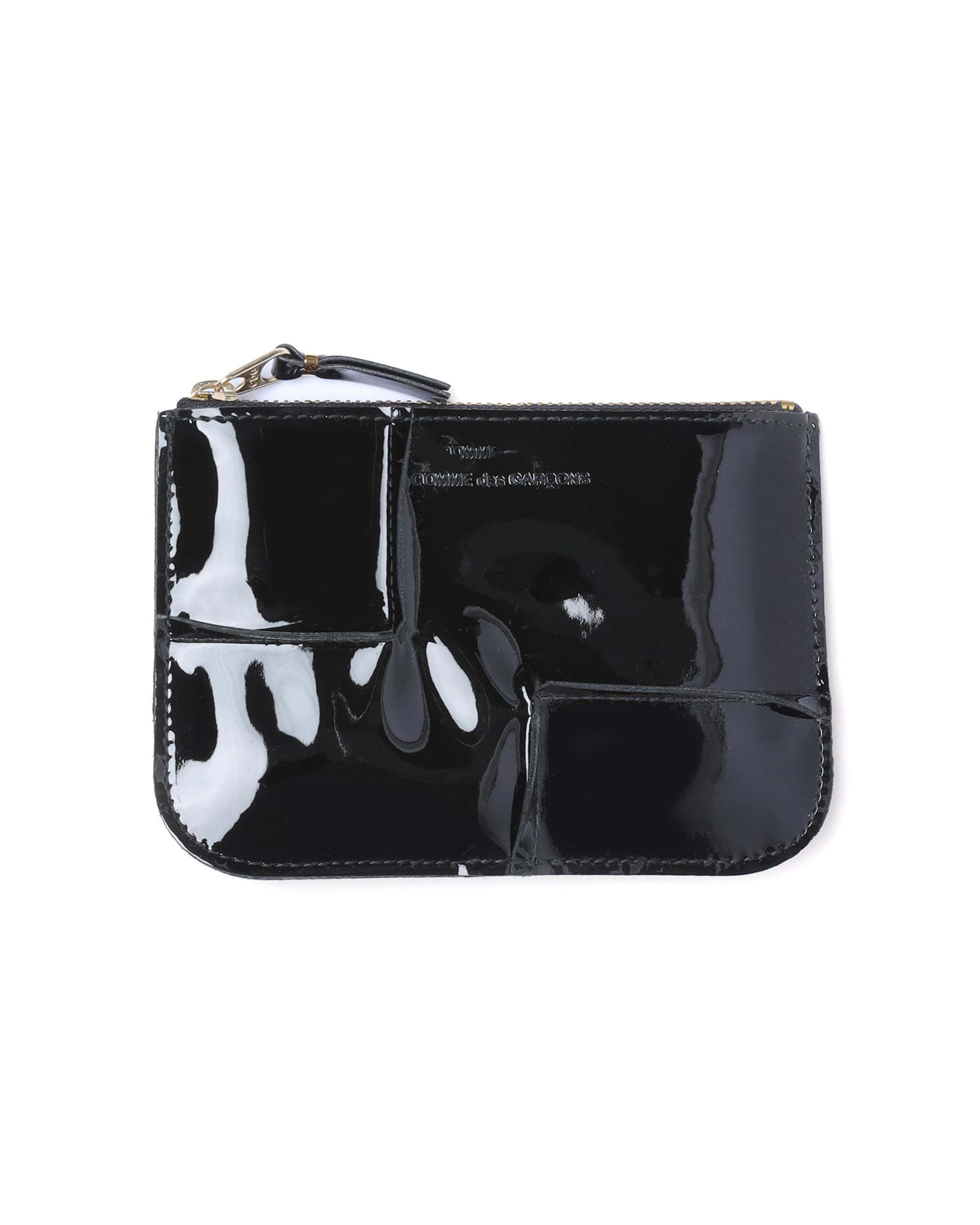 Reversed hem zip pouch by COMME DES GARCONS