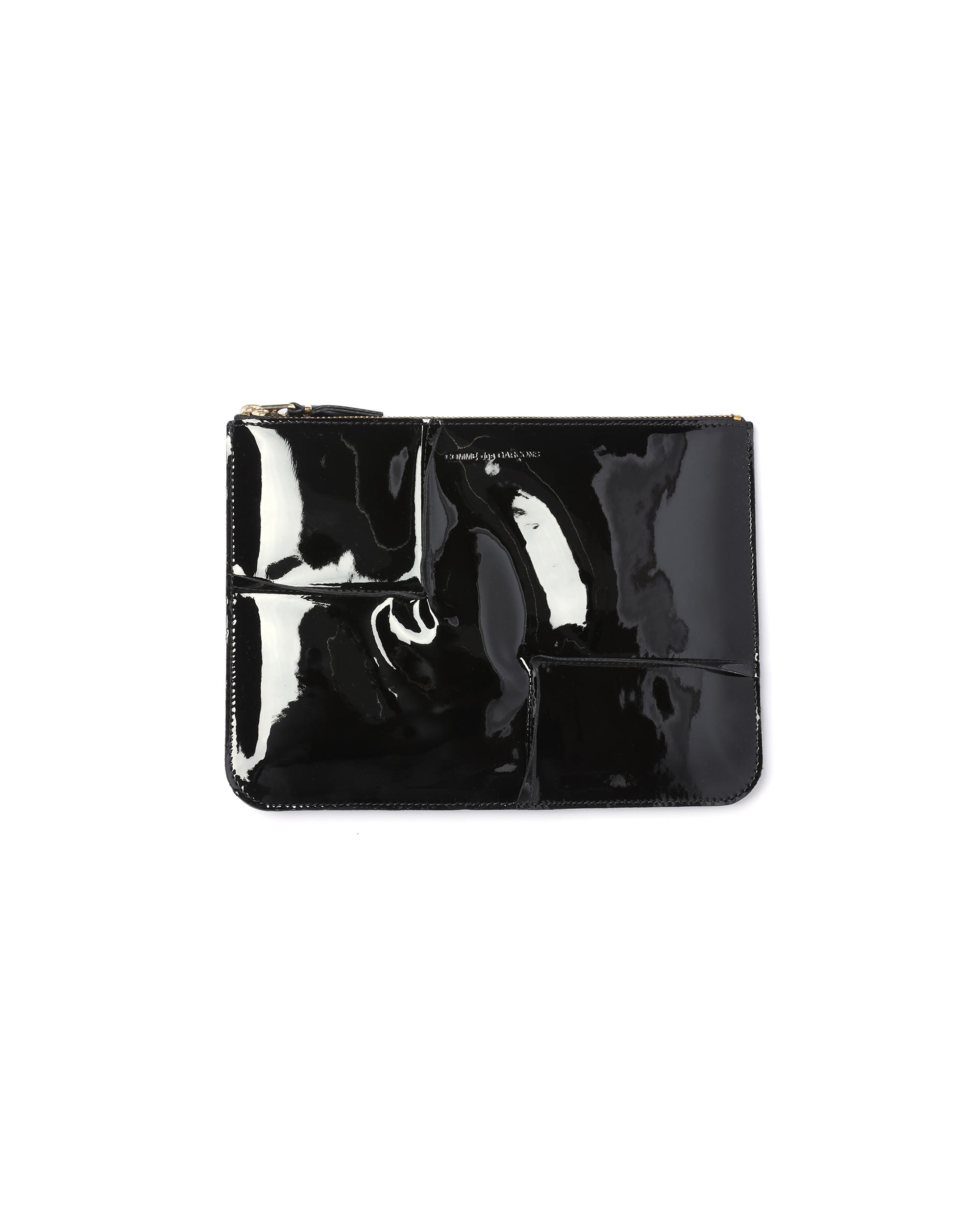 Reversed hem zip pouch by COMME DES GARCONS