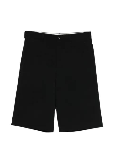 button-fastening trousers by COMME DES GARCONS
