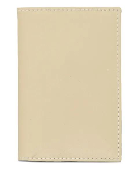 logo-embossed leather wallet by COMME DES GARCONS