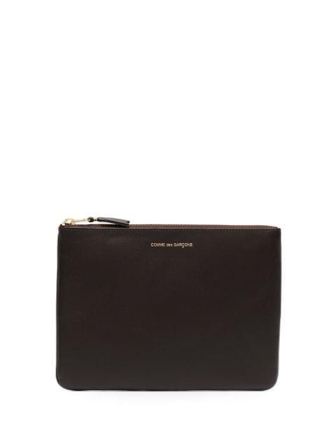 logo-print leather pouch by COMME DES GARCONS