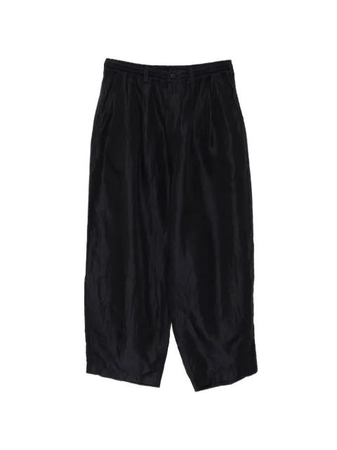 pinstripe crinkled-finish trousers by COMME DES GARCONS