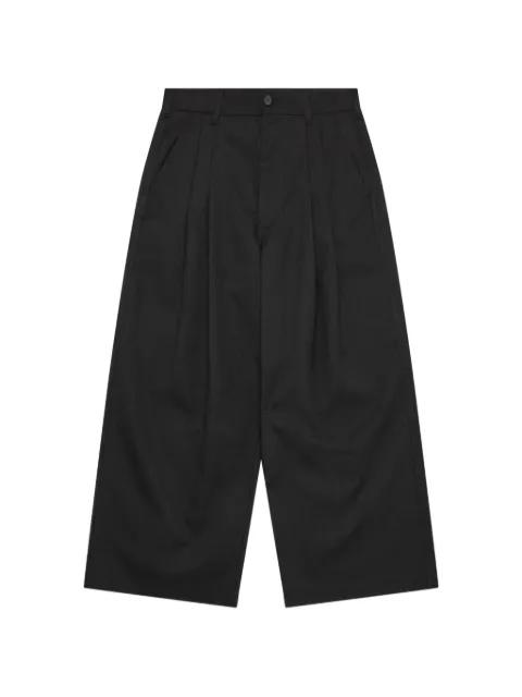 pleated pinstripe trousers by COMME DES GARCONS