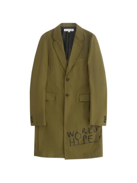 x Dan Perjovschi text-print coat by COMME DES GARCONS