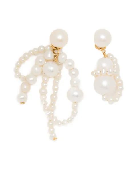 Pearl earrings by COMPLETEDWORKS