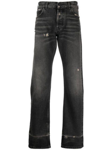 Cross distressed denim jeans by COUNTY OF MILAN
