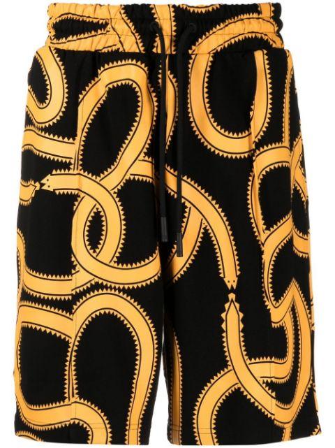 Snakes print track shorts by COUNTY OF MILAN