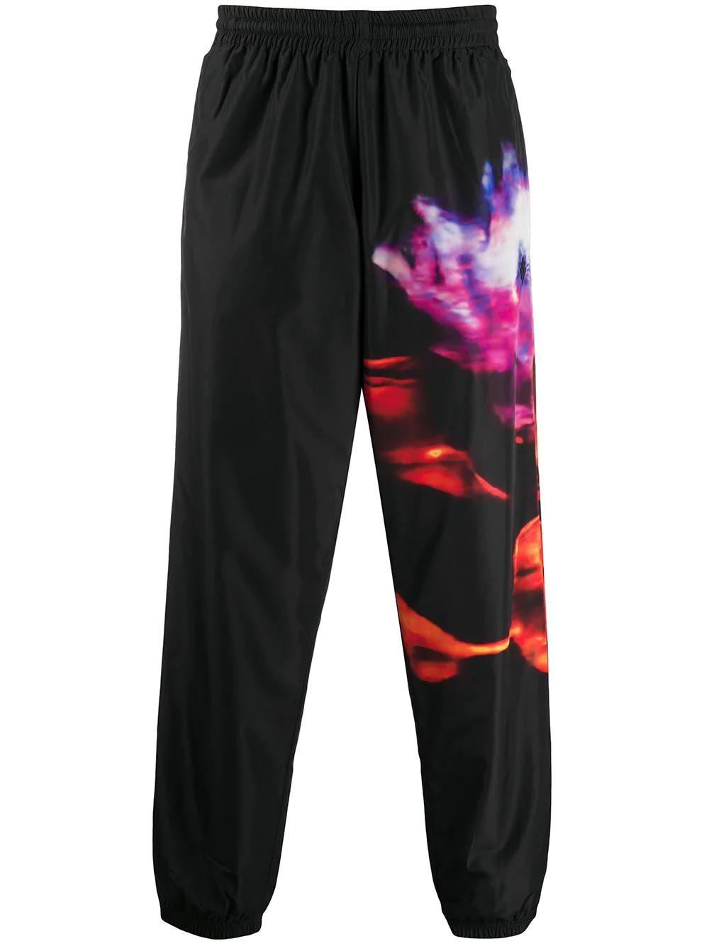 flower print track pants by COUNTY OF MILAN
