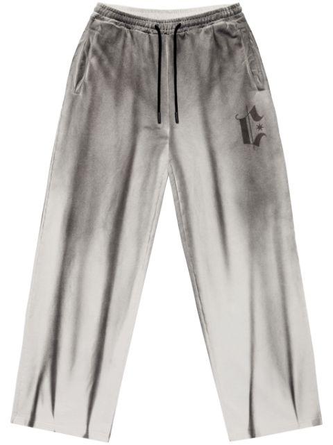 spray-effect track pants by COUNTY OF MILAN
