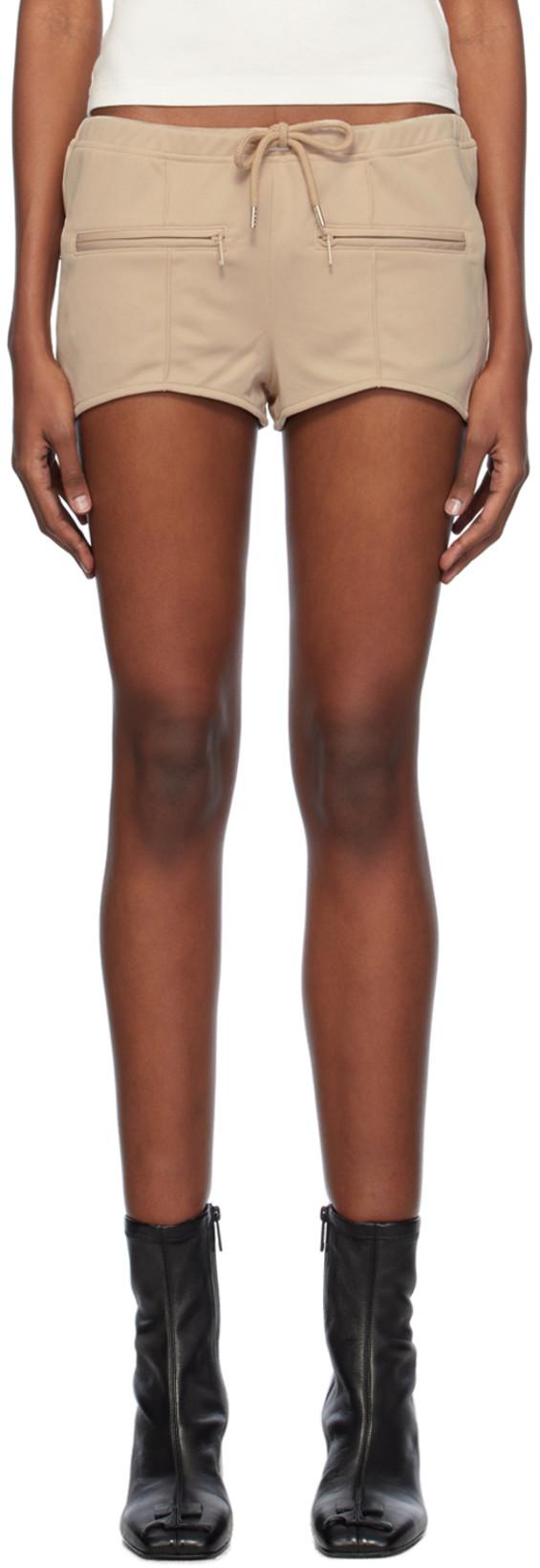 Beige Interlock Mini Shorts by COURREGES