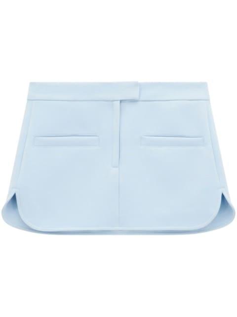 curved twill mini skirt by COURREGES