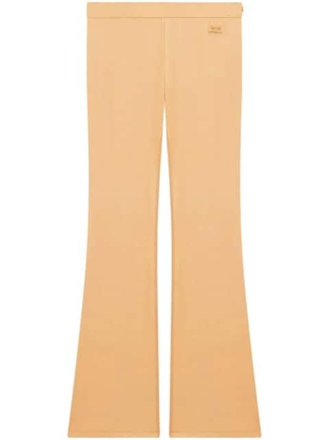 embroidered logo flared-leg trousers by COURREGES