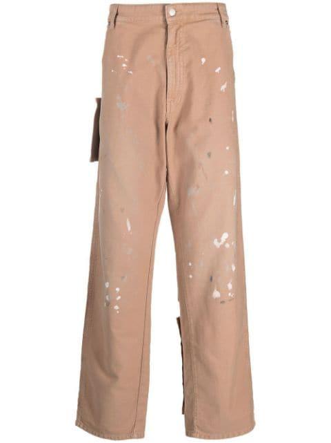 paint-splatter patch pocket jeans by DARKPARK
