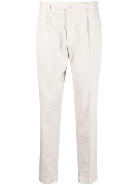 pleated tapered-leg trousers by DELL'OGLIO