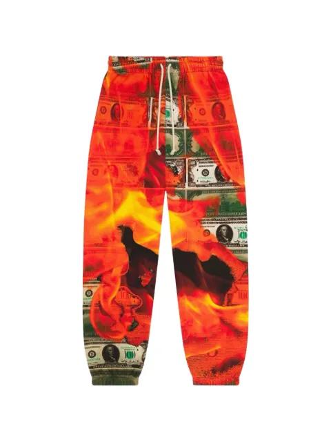 Burn It All printed track pants by DENIM TEARS