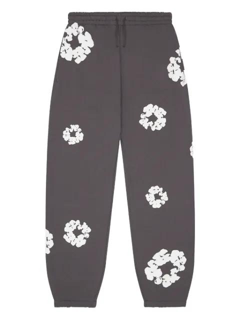 Cotton Wreath drawstring track pants by DENIM TEARS