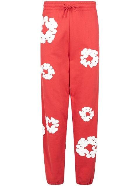 Cotton Wreath-print track pants by DENIM TEARS