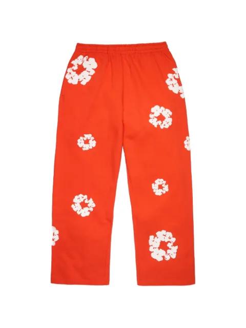 floral-print track pants by DENIM TEARS