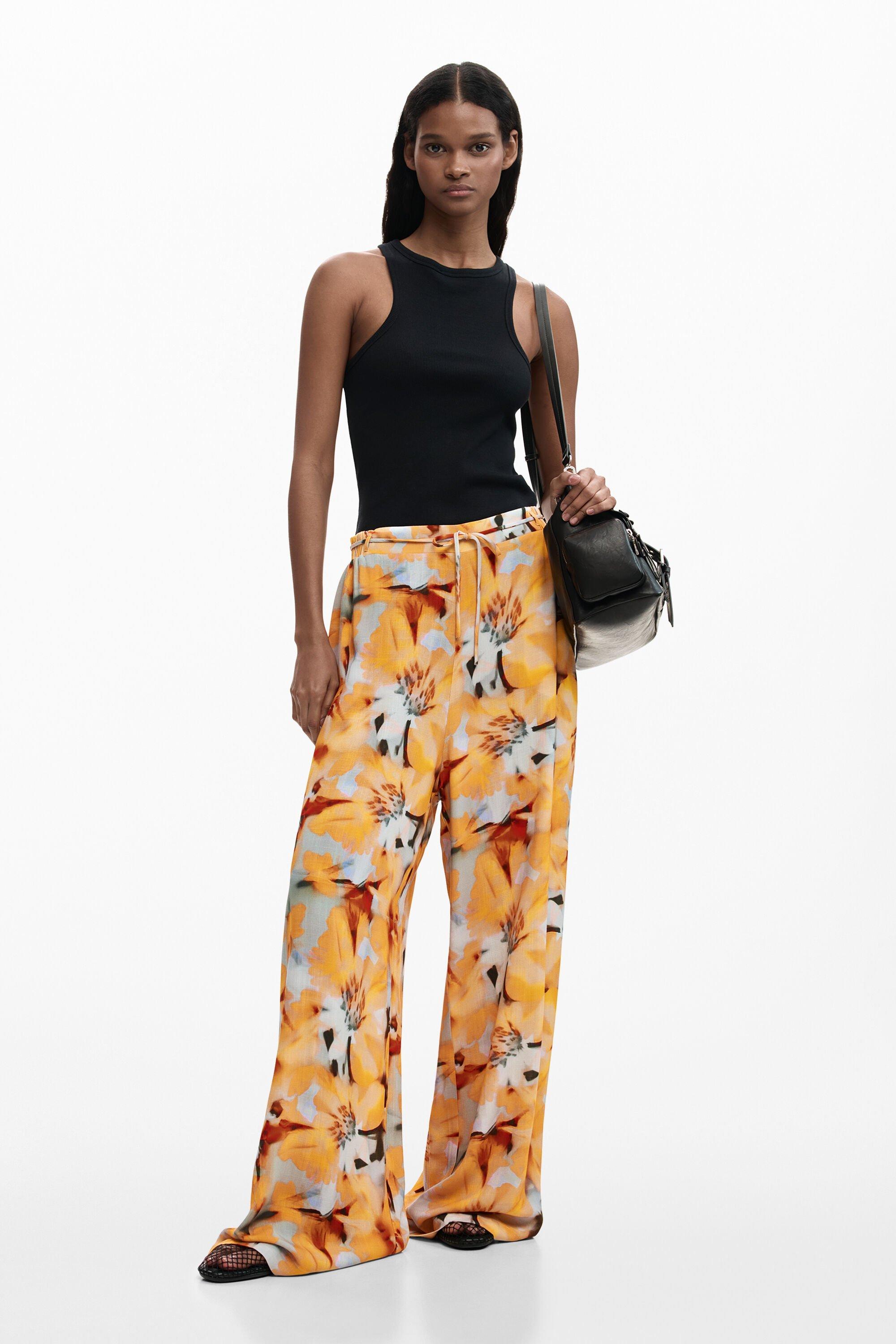 Flowy floral trousers by DESIGUAL