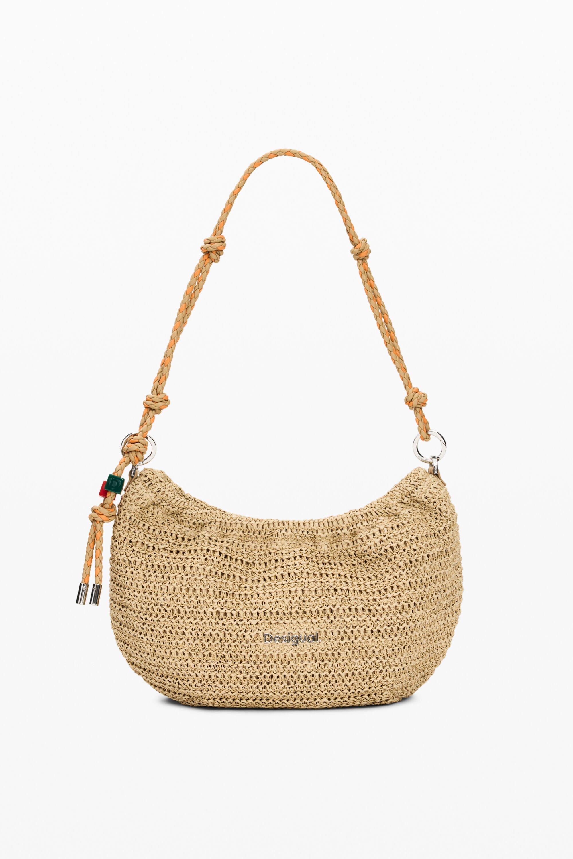 Medium oval raffia bag with charms by DESIGUAL