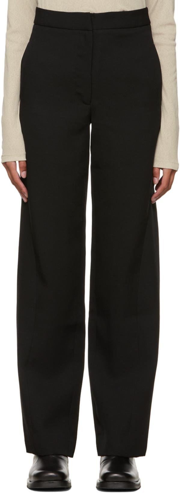 Black Twisted Inseams Trousers by DEVEAUX NEW YORK