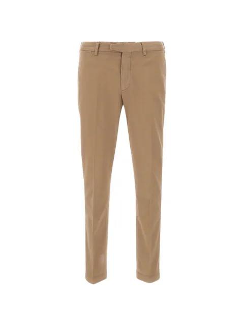 beige trousers by DEVORE