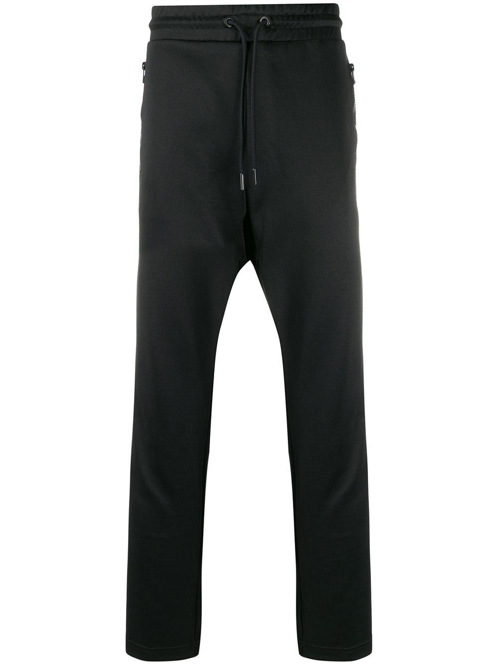 Track pants with knitted bands by DIESEL