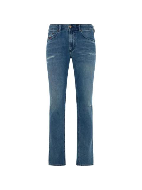 distressed boot-cut jeans by DIESEL